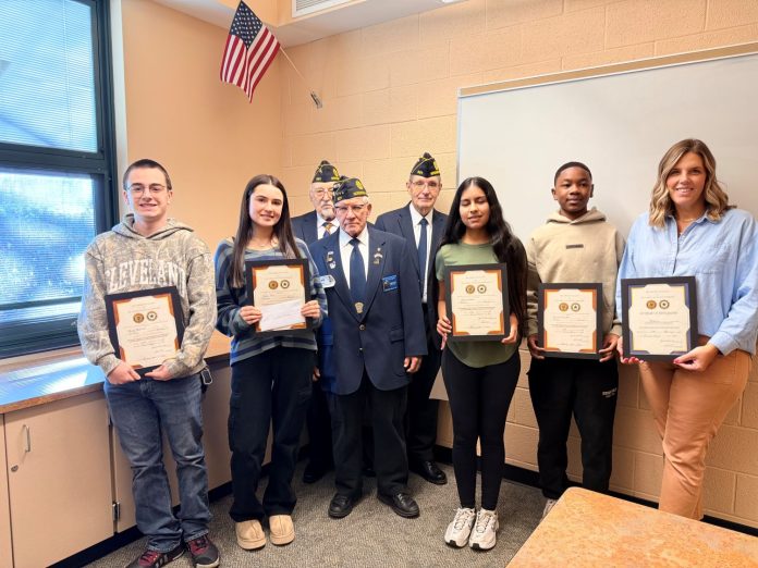 Award-winning Nordonia High School students stand with American Legion Post 801 members during the March 9 recognition ceremony